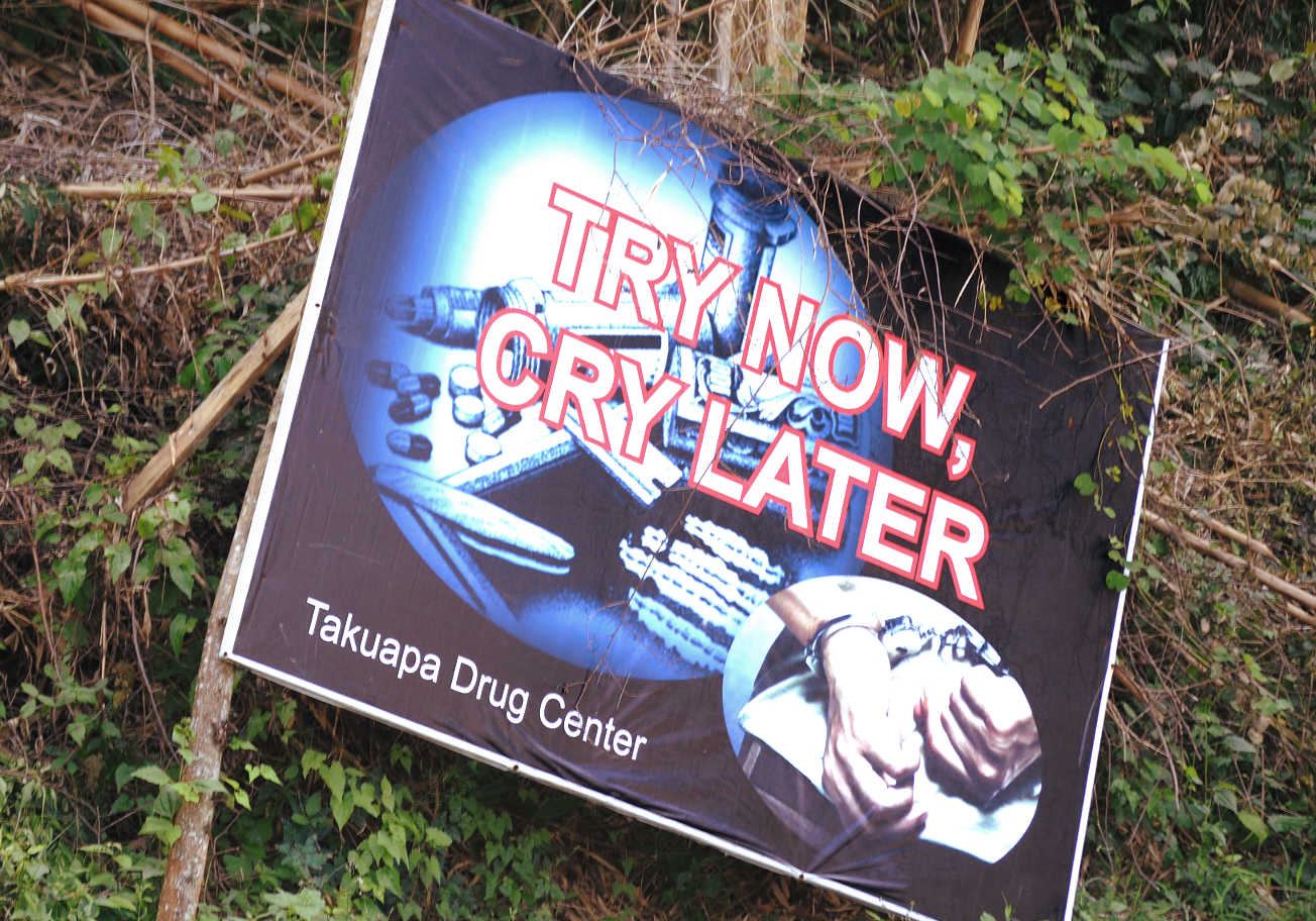 A warning sign in Phang Nga warning against drug use A warning sign in Thailand advising tourists about drugs